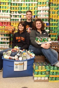 Brandi Center, Nella Worthan and Blake Miller help with the PTK Food Drive